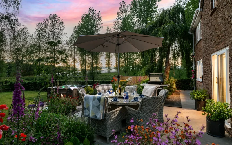 Alfresco dining at dusk, Old Barn House