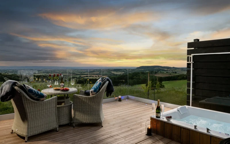Private decking with spa bath and outdoor dining overlooking beautiful countryside views stretching across multiple counties, Barn Owl Retreat
